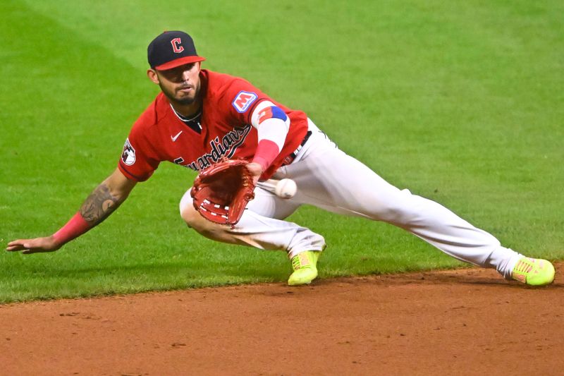 Sep 2, 2023; Cleveland, Ohio, USA; Cleveland Guardians shortstop Gabriel Arias (13) catches a line drive against the Tampa Bay Rays in the eleventh inning at Progressive Field. Mandatory Credit: David Richard-USA TODAY Sports