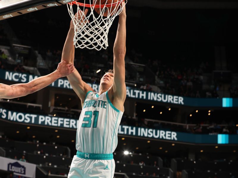 CHARLOTTE, NC - NOVEMBER 25:  Tidjane Salaun #31 of the Charlotte Hornets dunks the ball during the game against the Orlando Magic during a regular season game on November 25, 2024 at Spectrum Center in Charlotte, North Carolina. NOTE TO USER: User expressly acknowledges and agrees that, by downloading and or using this photograph, User is consenting to the terms and conditions of the Getty Images License Agreement. Mandatory Copyright Notice: Copyright 2024 NBAE (Photo by Kent Smith/NBAE via Getty Images)