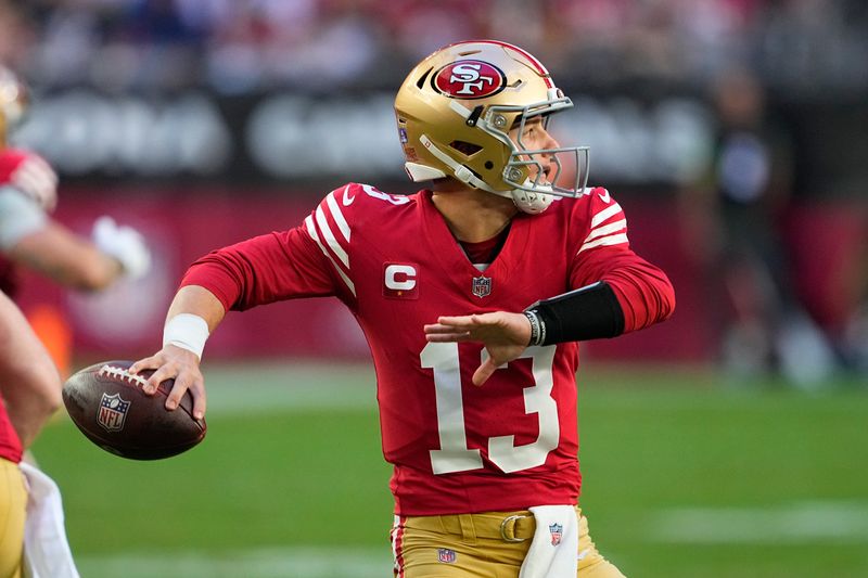 San Francisco 49ers quarterback Brock Purdy passes against the Arizona Cardinals during the first half of an NFL football game Sunday, Dec. 17, 2023, in Glendale, Ariz. (AP Photo/Matt York)