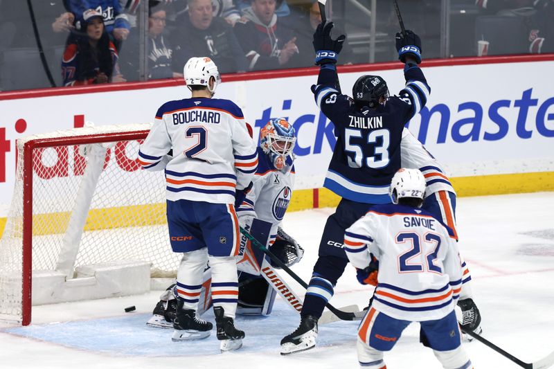Jan 8, 2026; Winnipeg, Manitoba, CAN; Winnipeg Jets centre Daniel Zhilkin (53) celebrates a goal by Winnipeg Jets left wing Tanner Pearson (70) on Edmonton Oilers goaltender Calvin Pickard (30) in the first period at Canada Life Centre. Mandatory Credit: James Carey Lauder-Imagn Images
