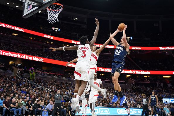 ORLANDO, FLORIDA - NOVEMBER 21: Franz Wagner #22 of the Orlando Magic shoots the ball over Scottie Barnes #4 of the Toronto Raptors during the second quarter at Amway Center on November 21, 2023 in Orlando, Florida. NOTE TO USER: User expressly acknowledges and agrees that, by downloading and or using this photograph, User is consenting to the terms and conditions of the Getty Images License Agreement. (Photo by Rich Storry/Getty Images)