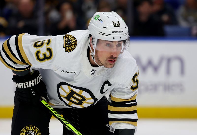 Dec 27, 2023; Buffalo, New York, USA;  Boston Bruins left wing Brad Marchand (63) waits for the face-off during the first period against the Buffalo Sabres at KeyBank Center. Mandatory Credit: Timothy T. Ludwig-USA TODAY Sports