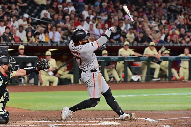 Jun 4, 2024; Phoenix, Arizona, USA;  San Francisco Giants outfielder Heliot Ramos (17) loses his bat in the third inning against the Arizona Diamondbacks at Chase Field. Mandatory Credit: Matt Kartozian-USA TODAY Sports