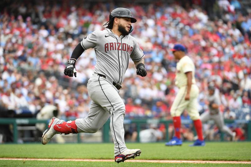 May 4, 2025; Philadelphia, Pennsylvania, USA; Arizona Arizona Diamondbacks catcher Jose Herrera (11) runs the bases after hitting a two-run double during the fourth inning against Philadelphia Phillies pitcher Ranger Suarez (55) at Citizens Bank Park. Mandatory Credit: Eric Hartline-Imagn Images