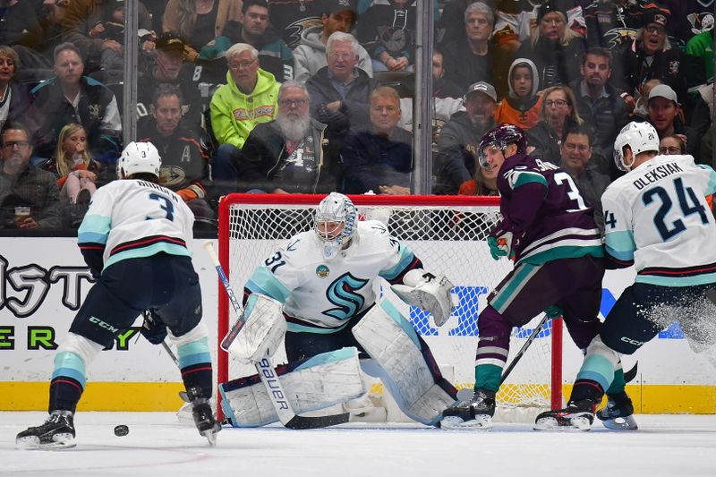 Apr 5, 2024; Anaheim, California, USA; Seattle Kraken defenseman Will Borgen (3) helps goaltender Philipp Grubauer (31) defend the goal against Anaheim Ducks right wing Jakob Silfverberg (33) during the first period at Honda Center. Mandatory Credit: Gary A. Vasquez-USA TODAY Sports