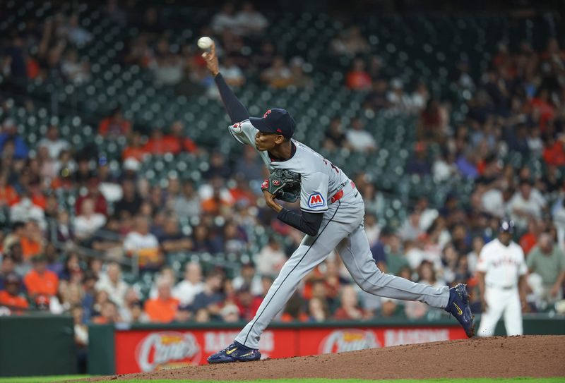 May 1, 2024; Houston, Texas, USA;  Cleveland Guardians starting pitcher Triston McKenzie (24) delivers a pitch during the first inning against the Houston Astros at Minute Maid Park. Mandatory Credit: Troy Taormina-USA TODAY Sports