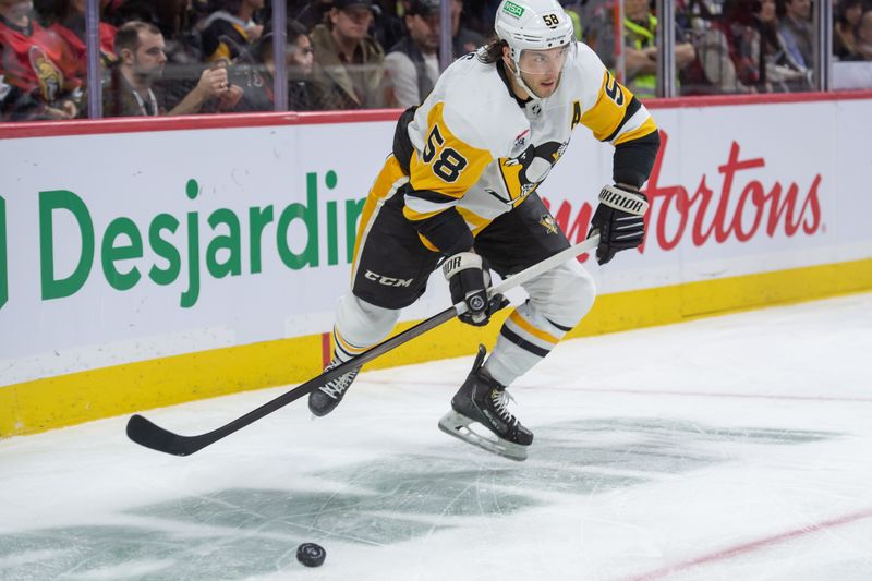 Dec 23, 2023; Ottawa, Ontario, CAN; Pittsburgh Penguins defenseman Kris Letang (58) skates with the puck in the first period against the Ottawa Senators at the Canadian Tire Centre. Mandatory Credit: Marc DesRosiers-USA TODAY Sports