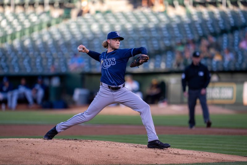 Aug 20, 2024; Oakland, California, USA; Tampa Bay Rays starting pitcher Shane Baz (11) delivers a pitch against the Oakland Athletics during the first inning at Oakland-Alameda County Coliseum. Mandatory Credit: Neville E. Guard-USA TODAY Sports