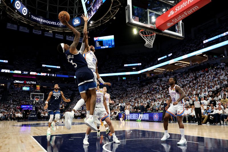 MINNEAPOLIS, MINNESOTA - MAY 24: Jaden McDaniels #3 of the Minnesota Timberwolves shoots the ball against Aaron Wiggins #21 of the Oklahoma City Thunder during the third quarter in Game Three of the Western Conference Finals of the 2025 NBA Playoffs at Target Center on May 24, 2025 in Minneapolis, Minnesota. NOTE TO USER: User expressly acknowledges and agrees that, by downloading and or using this photograph, User is consenting to the terms and conditions of the Getty Images License Agreement. (Photo by David Berding/Getty Images)