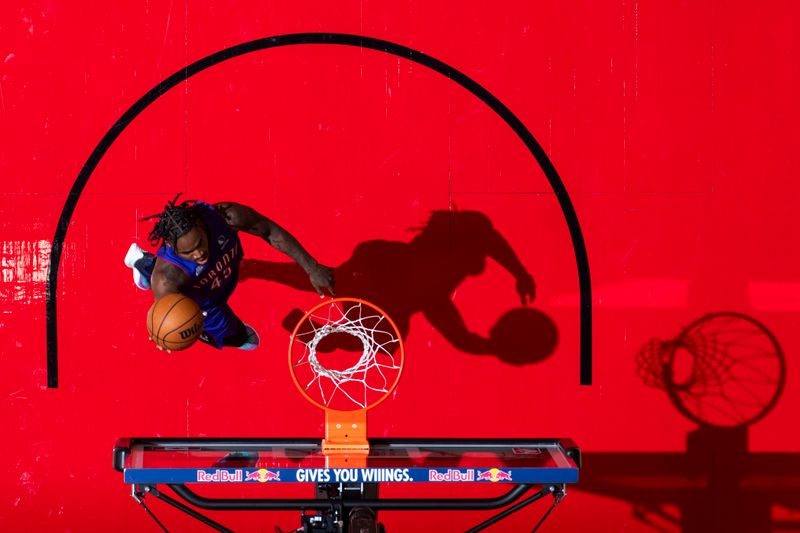 TORONTO, CANADA - OCTOBER 23: Davion Mitchell #45 of the Toronto Raptors drives to the basket during the game against the Cleveland Cavaliers on October 23, 2024 at the Scotiabank Arena in Toronto, Ontario, Canada.  NOTE TO USER: User expressly acknowledges and agrees that, by downloading and or using this Photograph, user is consenting to the terms and conditions of the Getty Images License Agreement.  Mandatory Copyright Notice: Copyright 2024 NBAE (Photo by Mark Blinch/NBAE via Getty Images)