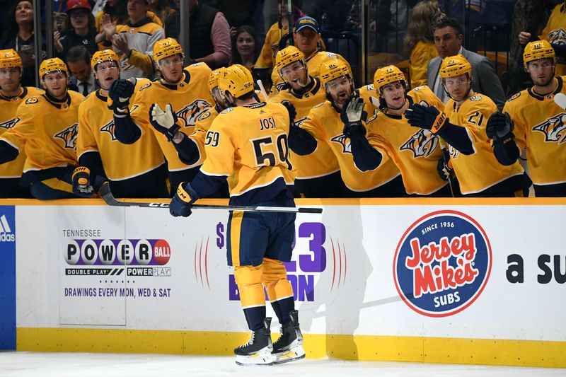 Apr 4, 2024; Nashville, Tennessee, USA; Nashville Predators defenseman Roman Josi (59) celebrates with teammates after a goal during the first period against the St. Louis Blues at Bridgestone Arena. Mandatory Credit: Christopher Hanewinckel-USA TODAY Sports