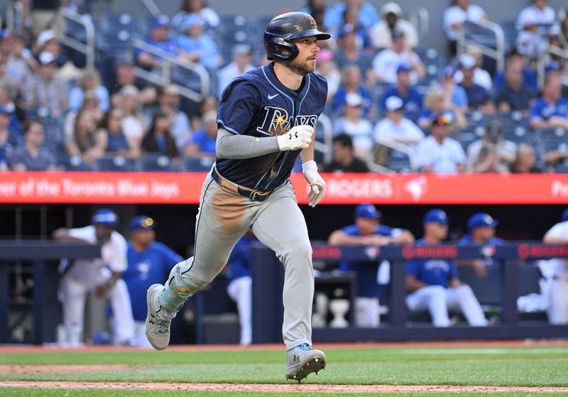 Jul 25, 2024; Toronto, Ontario, CAN;   Tampa Bay Rays designated hitter Brandon Lowe (8) runs toward second base after hitting a double against the Toronto Blue Jays in the ninth inning at Rogers Centre. Mandatory Credit: Dan Hamilton-USA TODAY Sports