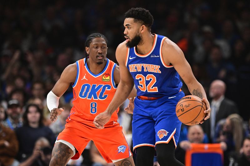 OKLAHOMA CITY, OKLAHOMA - JANUARY 03: Karl-Anthony Towns #32 of the New York Knicks handles the ball in front of Jalen Williams #8 of the Oklahoma City Thunder during the first half at Paycom Center on January 3, 2025 in Oklahoma City, Oklahoma. NOTE TO USER: User expressly acknowledges and agrees that, by downloading and or using this photograph, User is consenting to the terms and conditions of the Getty Images License Agreement. (Photo by Joshua Gateley/Getty Images)