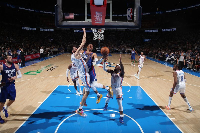 OKLAHOMA CITY, OK - FEBRUARY 22: Russell Westbrook #0 of the LA Clippers drives to the basket during the game against the Oklahoma City Thunder on February 22SF, 2024 at Paycom Arena in Oklahoma City, Oklahoma. NOTE TO USER: User expressly acknowledges and agrees that, by downloading and or using this photograph, User is consenting to the terms and conditions of the Getty Images License Agreement. Mandatory Copyright Notice: Copyright 2024 NBAE (Photo by Zach Beeker/NBAE via Getty Images)