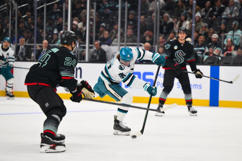 Nov 5, 2025; Seattle, Washington, USA; San Jose Sharks right wing Adam Gaudette (81) shoots the puck against the Seattle Kraken during the first period at Climate Pledge Arena. Mandatory Credit: Steven Bisig-Imagn Images