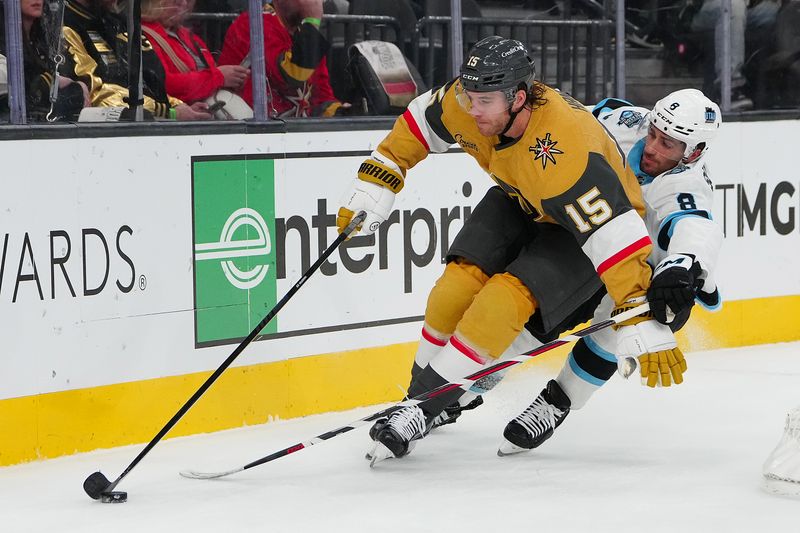 Nov 2, 2024; Las Vegas, Nevada, USA; Vegas Golden Knights defenseman Noah Hanifin (15) skates ahead of Utah Hockey Club center Nick Schmaltz (8) during the first period at T-Mobile Arena. Mandatory Credit: Stephen R. Sylvanie-Imagn Images