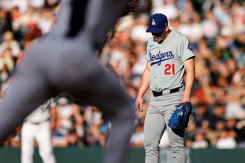 Jun 18, 2024; Denver, Colorado, USA; Los Angeles Dodgers starting pitcher Walker Buehler (21) reacts after giving up a hit in the first inning against the Colorado Rockies at Coors Field. Mandatory Credit: Isaiah J. Downing-USA TODAY Sports