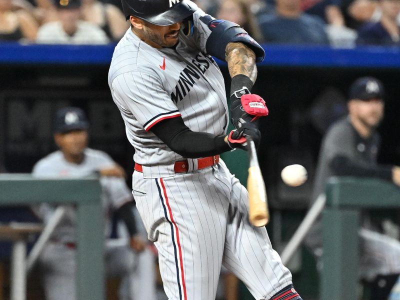 Jul 29, 2023; Kansas City, Missouri, USA;  Minnesota Twins shortstop Carlos Correa (4) singles against the Kansas City Royals during the eighth inning at Kauffman Stadium. Mandatory Credit: Peter Aiken-USA TODAY Sports