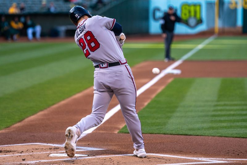 May 30, 2023; Oakland, California, USA;  Atlanta Braves first baseman Matt Olson (28) hits a single against the Oakland Athletics during the first inning at Oakland-Alameda County Coliseum. Mandatory Credit: Neville E. Guard-USA TODAY Sports