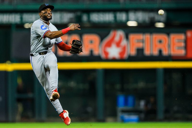 Jul 12, 2024; Cincinnati, Ohio, USA; Miami Marlins second baseman Vidal Brujan (17) throws to first in attempt to get Cincinnati Reds shortstop Elly De La Cruz (not pictured) out in the eighth inning at Great American Ball Park. Mandatory Credit: Katie Stratman-USA TODAY Sports