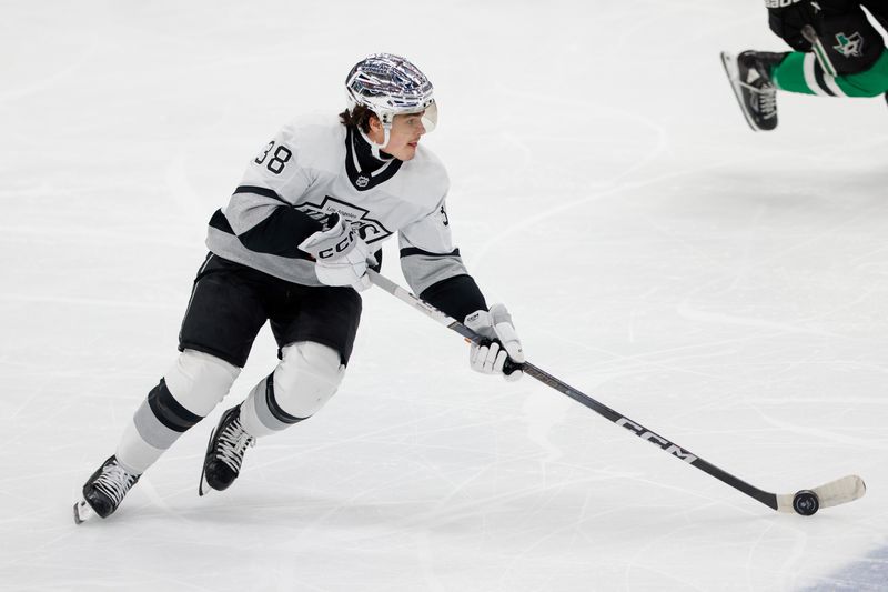 Mar 16, 2024; Dallas, Texas, USA; Los Angeles Kings center Alex Turcotte (38) brings the puck up the ice during the first period against the Dallas Stars at American Airlines Center. Mandatory Credit: Andrew Dieb-USA TODAY Sports