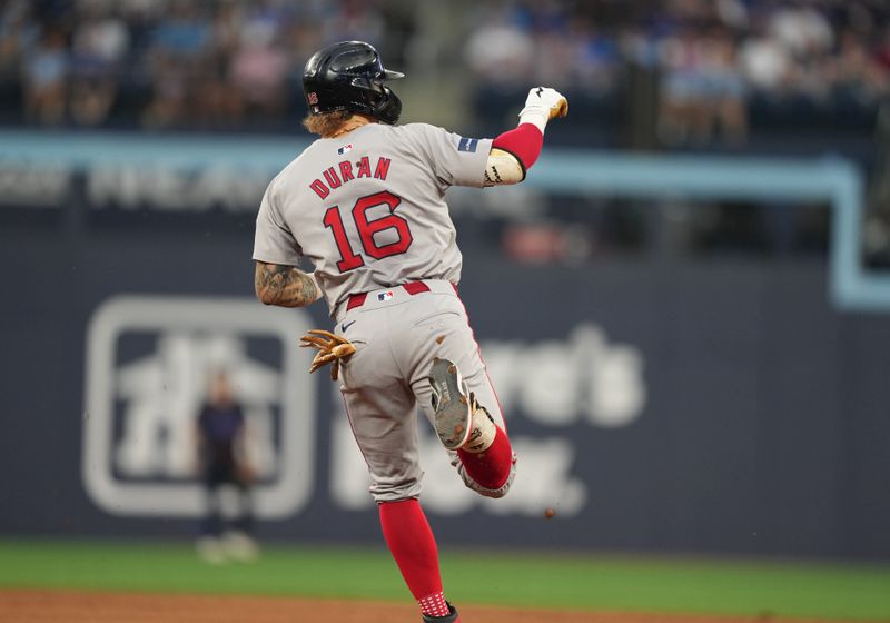 Jun 19, 2024; Toronto, Ontario, CAN; Boston Red Sox right fielder Jarren Duran (16) runs the bases after hitting a home run against the Toronto Blue Jays during fifth inning at Rogers Centre. Mandatory Credit: Nick Turchiaro-USA TODAY Sports