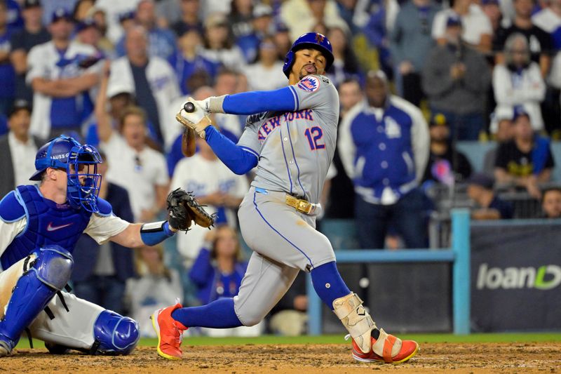 Oct 20, 2024; Los Angeles, California, USA; New York Mets shortstop Francisco Lindor (12) strikes out to end the seventh inning against the Los Angeles Dodgers during game six of the NLCS for the 2024 MLB playoffs at Dodger Stadium. Mandatory Credit: Jayne Kamin-Oncea-Imagn Images