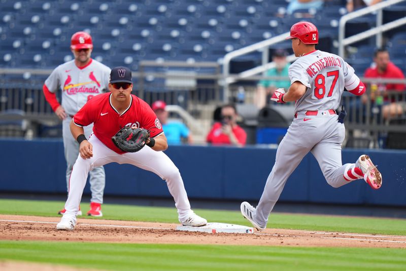 Mar 4, 2025; West Palm Beach, Florida, USA; Washington Nationals first base Nathaniel Lowe (33) tags out St. Louis Cardinals infeilder JJ Wetherholt (87) during the third inning at CACTI Park of the Palm Beaches. Mandatory Credit: Rich Storry-Imagn Images