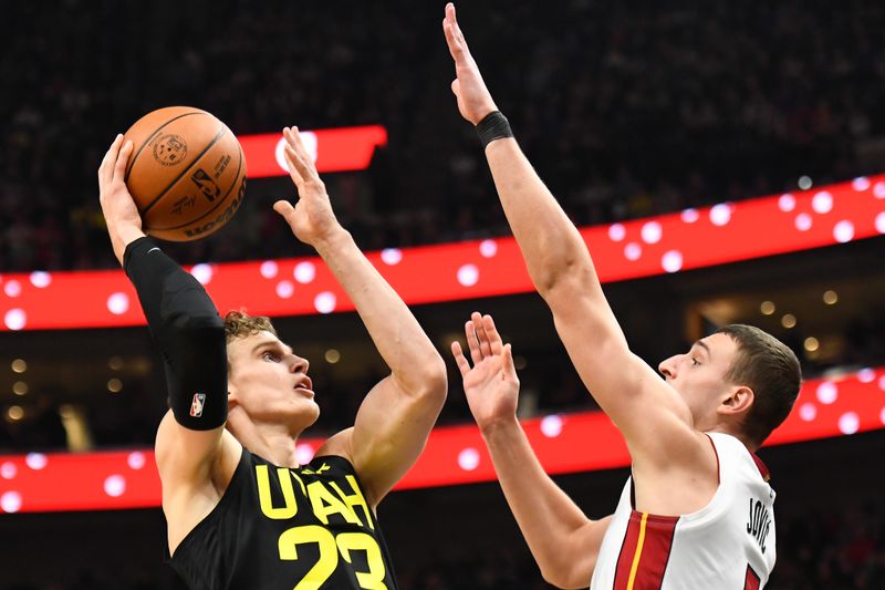 SALT LAKE CITY, UTAH - DECEMBER 30: Lauri Markkanen #23 of the Utah Jazz shoots over Nikola Jovic #5 of the Miami Heat during the first half of a game at Delta Center on December 30, 2023 in Salt Lake City, Utah. NOTE TO USER: User expressly acknowledges and agrees that, by downloading and or using this photograph, User is consenting to the terms and conditions of the Getty Images License Agreement. (Photo by Alex Goodlett/Getty Images)