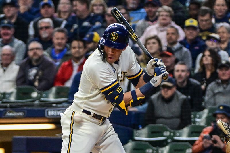 Apr 26, 2023; Milwaukee, Wisconsin, USA; Milwaukee Brewers left fielder Christian Yelich (22) is hit by a pitch in the first inning during game against Detroit Tigers at American Family Field. Mandatory Credit: Benny Sieu-USA TODAY Sports