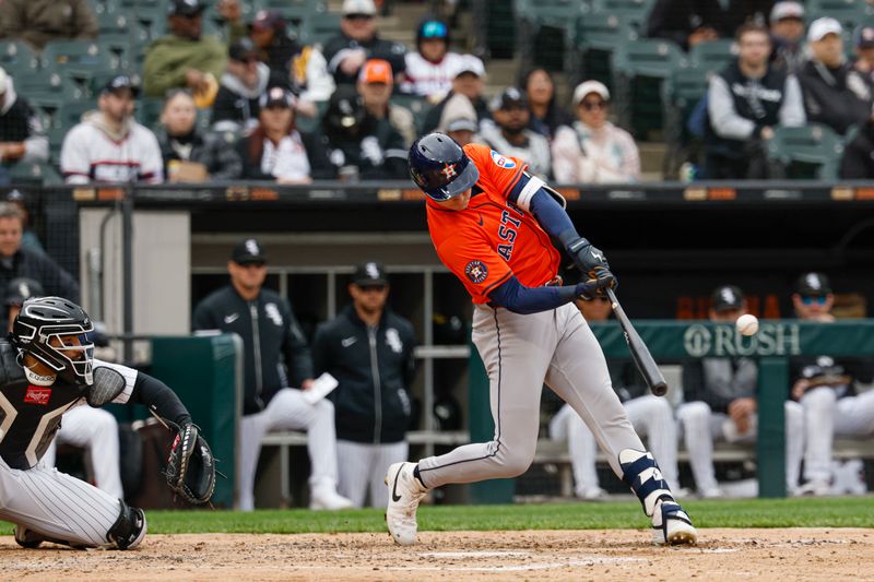 May 4, 2025; Chicago, Illinois, USA; Houston Astros right fielder Zach Dezenzo (9) hits a two-run home run against the Chicago White Sox during the fifth inning at Rate Field. Mandatory Credit: Kamil Krzaczynski-Imagn Images