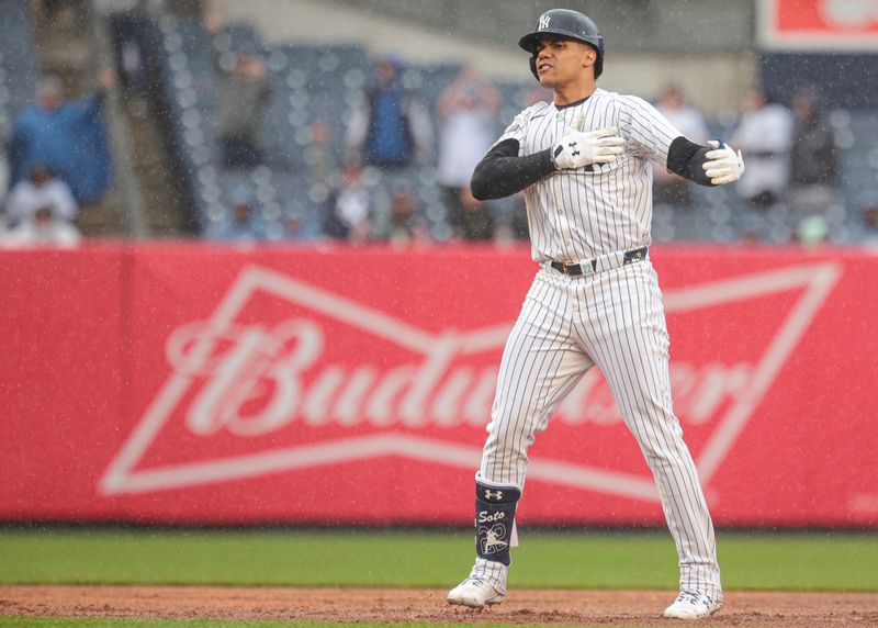 May 5, 2024; Bronx, New York, USA; New York Yankees right fielder Juan Soto (22) reacts after his three RBI double during the seventh inning against the Detroit Tigers at Yankee Stadium. Mandatory Credit: Vincent Carchietta-USA TODAY Sports