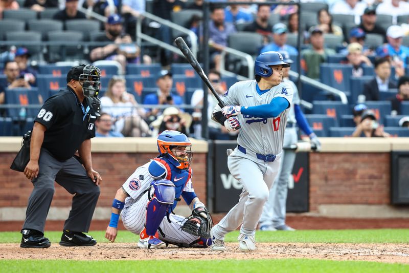 May 29, 2024; New York City, New York, USA;  Los Angeles Dodgers designated hitter Shohei Ohtani (17) hits an RBI single in the fifth inning against the New York Mets at Citi Field. Mandatory Credit: Wendell Cruz-USA TODAY Sports