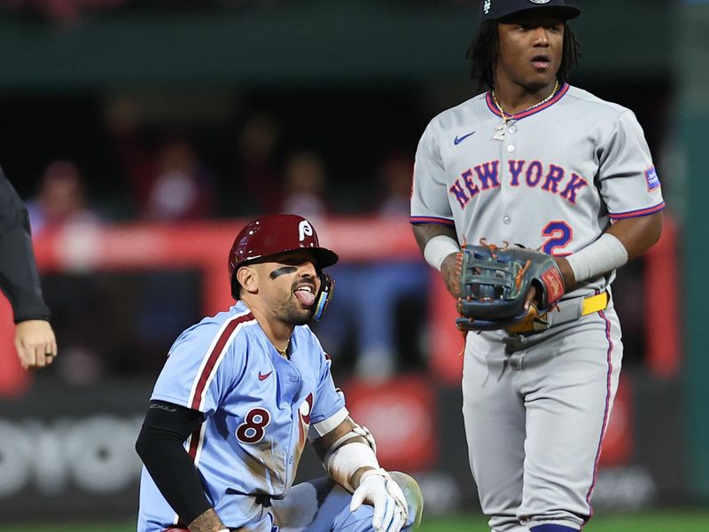 Sep 11, 2025; Philadelphia, Pennsylvania, USA; Philadelphia Phillies outfielder Nick Castellanos (8) reacts next to New York Mets second base Luisangel Acuna (2) after hitting a double during the sixth inning at Citizens Bank Park. Mandatory Credit: Bill Streicher-Imagn Images