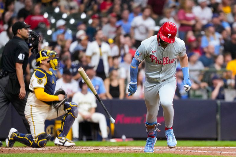 Sep 17, 2024; Milwaukee, Wisconsin, USA;  Philadelphia Phillies first baseman Bryce Harper (3) flips his bat after hitting a home run during the sixth inning against the Milwaukee Brewers at American Family Field. Mandatory Credit: Jeff Hanisch-Imagn Images