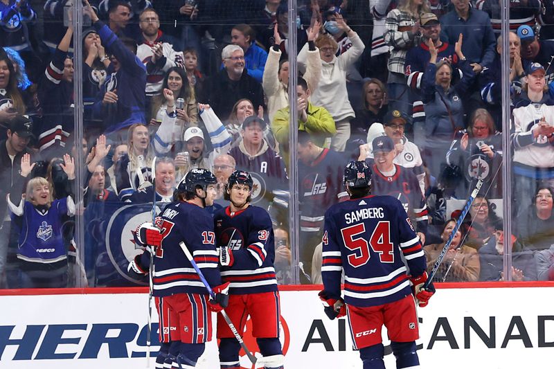 Feb 14, 2024; Winnipeg, Manitoba, CAN; Winnipeg Jets center Morgan Barron (36) celebrates his first period goal against the San Jose Sharks at Canada Life Centre. Mandatory Credit: James Carey Lauder-USA TODAY Sports