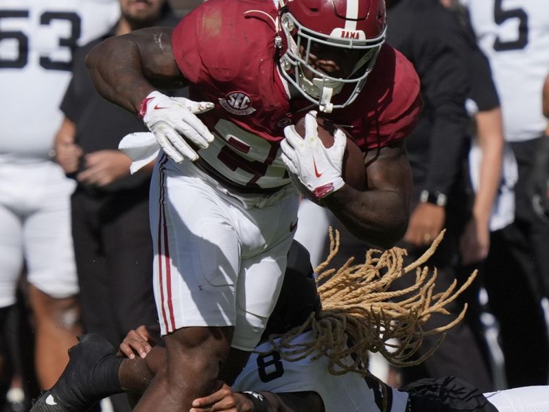 Oct 4, 2025; Tuscaloosa, Alabama, USA;  Alabama running back Jam Miller (26) breaks a tackle by Vanderbilt defensive back CJ Heard (8) at Saban Field at Bryant-Denny Stadium. Mandatory Credit: Gary Cosby Jr.-USA TODAY Network via Imagn Images