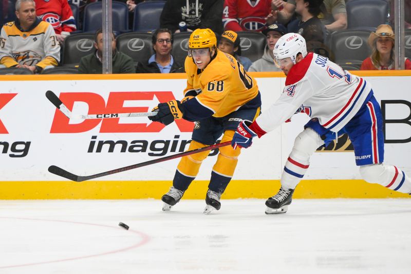 Apr 6, 2025; Nashville, Tennessee, USA; Nashville Predators left wing Zachary L'Heureux (68) blocks the shot of Montreal Canadiens center Nick Suzuki (14) during the third period at Bridgestone Arena. Mandatory Credit: Steve Roberts-Imagn Images