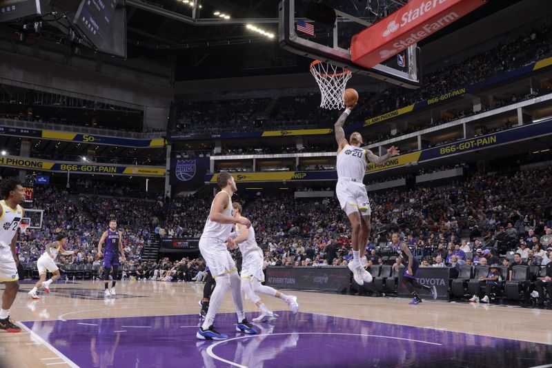 SACRAMENTO, CA - DECEMBER 8: John Collins #20 of the Utah Jazz rebounds the ball during the game against the Sacramento Kings on December 8, 2024 at Golden 1 Center in Sacramento, California. NOTE TO USER: User expressly acknowledges and agrees that, by downloading and or using this Photograph, user is consenting to the terms and conditions of the Getty Images License Agreement. Mandatory Copyright Notice: Copyright 2024 NBAE (Photo by Rocky Widner/NBAE via Getty Images)