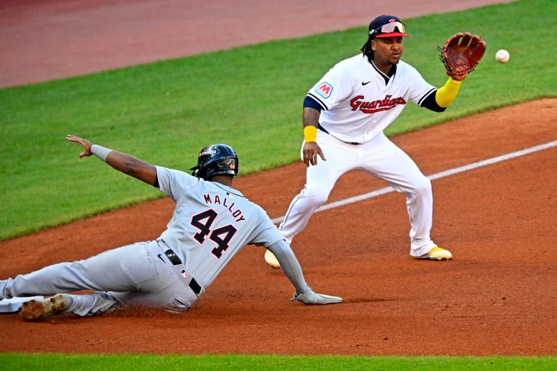 Oct 7, 2024; Cleveland, Ohio, USA; Detroit Tigers outfielder Justyn-Henry Malloy (44) reaches third base before the throw to Cleveland Guardians third base José Ramírez (11) during the third inning during game two of the ALDS for the 2024 MLB Playoffs at Progressive Field. Mandatory Credit: David Richard-Imagn Images