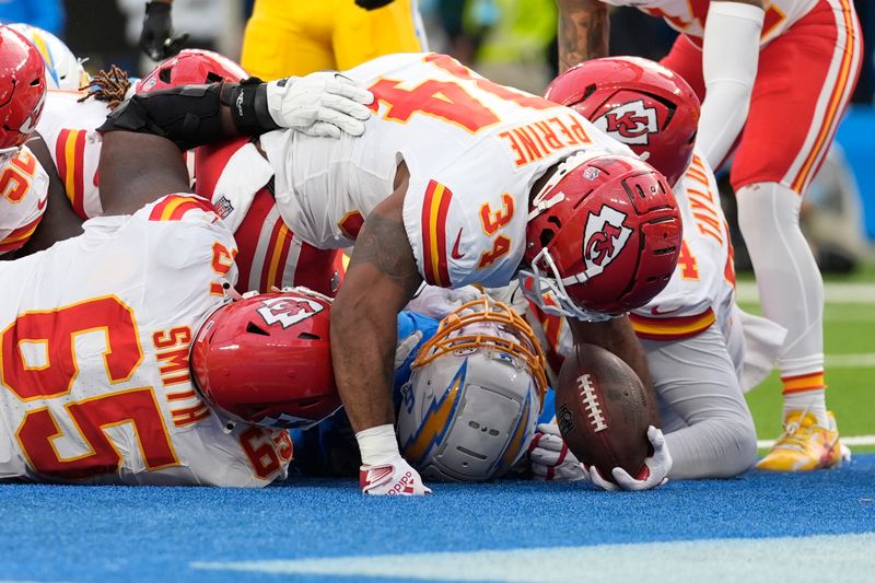 Kansas City Chiefs running back Samaje Perine (34) scores on a 2-yard run during the second half of an NFL football game against the Los Angeles Chargers Sunday, Sept. 29, 2024, in Inglewood, Calif. (AP Photo/Ashley Landis)