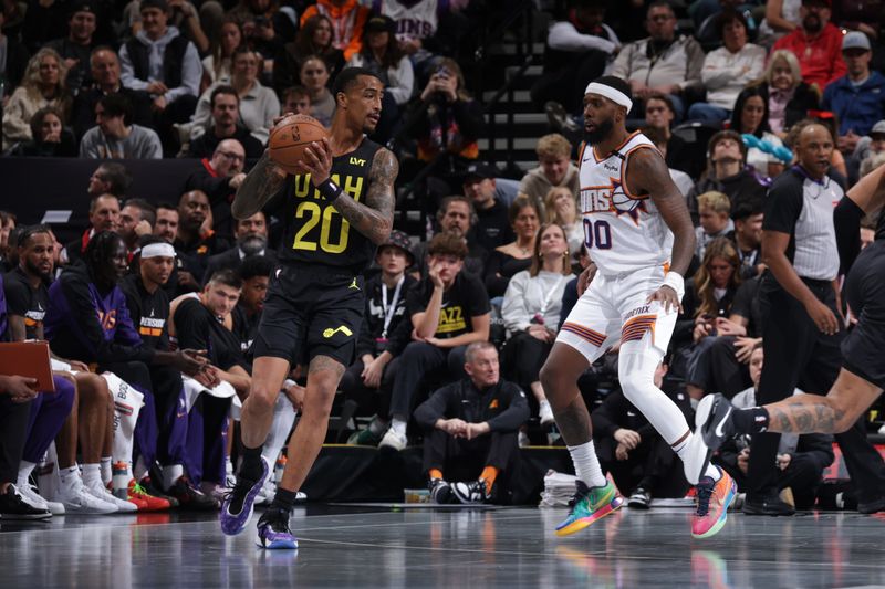 SALT LAKE CITY, UT - NOVEMBER 12: John Collins #20 of the Utah Jazz looks to pass the ball during the game against the Phoenix Suns during the Emirates NBA Cup game on November 12, 2024 at vivint.SmartHome Arena in Salt Lake City, Utah. NOTE TO USER: User expressly acknowledges and agrees that, by downloading and or using this Photograph, User is consenting to the terms and conditions of the Getty Images License Agreement. Mandatory Copyright Notice: Copyright 2024NBAE (Photo by Melissa Majchrzak/NBAE via Getty Images)