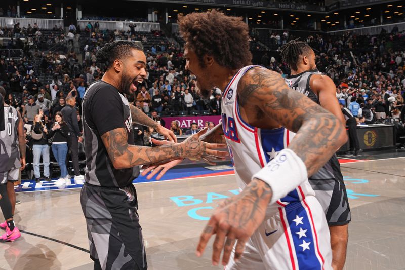 BROOKLYN, NY - FEBRUARY 12: D'Angelo Russell #1 greets Kelly Oubre Jr. #9 of the Philadelphia 76ers after the game on February 12, 2025 at Barclays Center in Brooklyn, New York. NOTE TO USER: User expressly acknowledges and agrees that, by downloading and or using this Photograph, user is consenting to the terms and conditions of the Getty Images License Agreement. Mandatory Copyright Notice: Copyright 2025 NBAE (Photo by Jesse D. Garrabrant/NBAE via Getty Images)