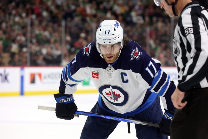 Apr 6, 2024; Saint Paul, Minnesota, USA; Winnipeg Jets center Adam Lowry (17) prepares to take a draw during the second period against the Minnesota Wild at Xcel Energy Center. Mandatory Credit: Bruce Fedyck-USA TODAY Sports