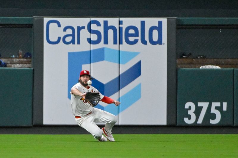Jul 30, 2024; St. Louis, Missouri, USA;  St. Louis Cardinals left fielder Alec Burleson (41) dives and catches a line drive against the Texas Rangers during the ninth inning at Busch Stadium. Mandatory Credit: Jeff Curry-USA TODAY Sports