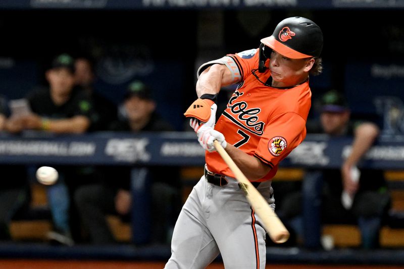 Aug 10, 2024; St. Petersburg, Florida, USA; Baltimore Orioles second baseman Jackson Holliday (7) hits a solo home run in the second inning against the Tampa Bay Rays at Tropicana Field. Mandatory Credit: Jonathan Dyer-USA TODAY Sports