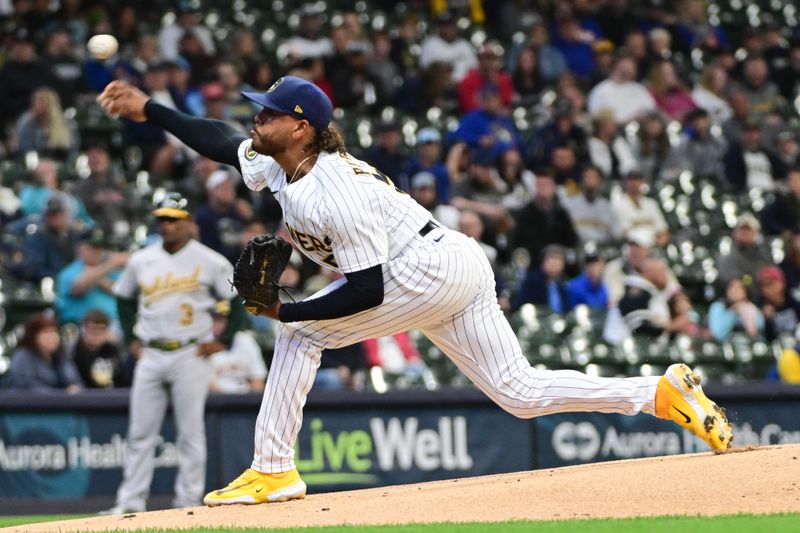 Jun 11, 2023; Milwaukee, Wisconsin, USA; Milwaukee Brewers pitcher Freddy Peralta (51) pitches against the Oakland Athletes in the first inning at American Family Field. Mandatory Credit: Benny Sieu-USA TODAY Sports