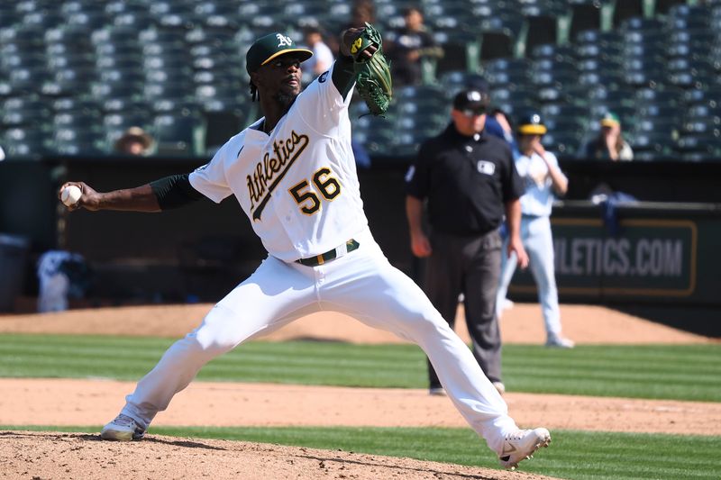 Sep 20, 2023; Oakland, California, USA; Oakland Athletics relief pitcher Dany Jimenez (56) throws against the Seattle Mariners during the ninth inning at Oakland-Alameda County Coliseum. Mandatory Credit: Kelley L Cox-USA TODAY Sports