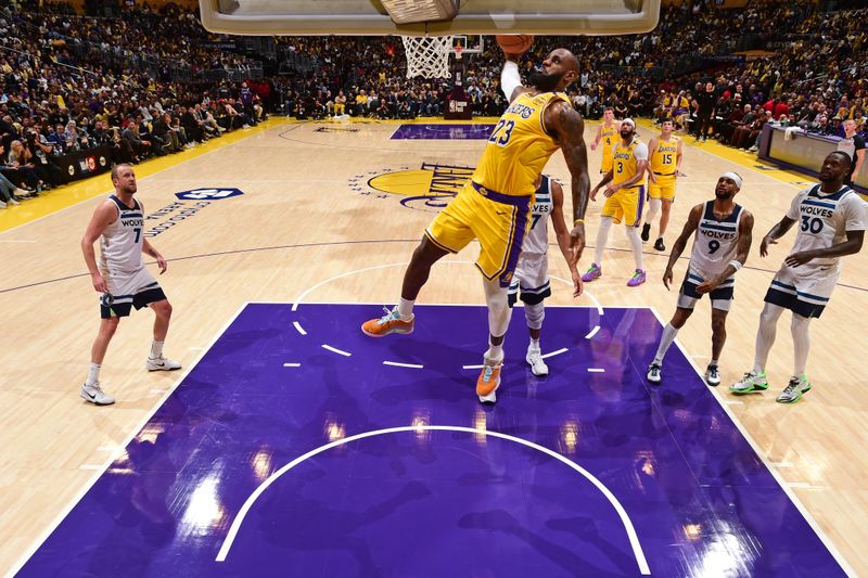 LOS ANGELES, CA - OCTOBER 22: LeBron James #23 of the Los Angeles Lakers dunks the ball during the game against the Minnesota Timberwolves on October 22, 2024 at Crypto.Com Arena in Los Angeles, California. NOTE TO USER: User expressly acknowledges and agrees that, by downloading and/or using this Photograph, user is consenting to the terms and conditions of the Getty Images License Agreement. Mandatory Copyright Notice: Copyright 2024 NBAE (Photo by Adam Pantozzi/NBAE via Getty Images)