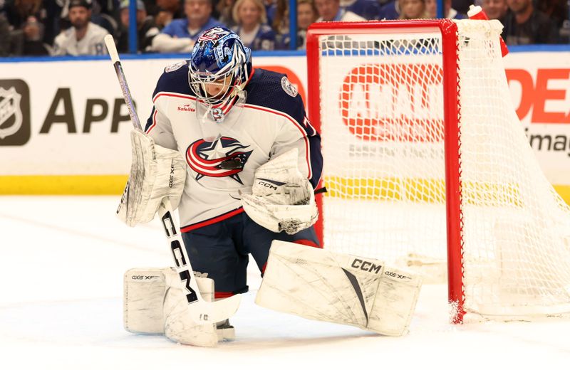 Apr 9, 2024; Tampa, Florida, USA; Columbus Blue Jackets goaltender Jet Greaves (73) makes a save against the Tampa Bay Lightning during the first period at Amalie Arena. Mandatory Credit: Kim Klement Neitzel-USA TODAY Sports